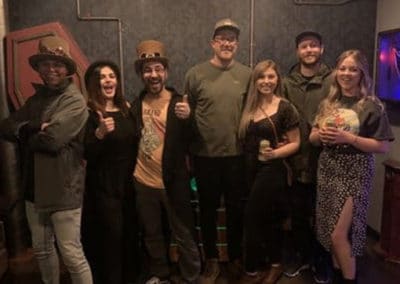 group photo of escape room players in Reno
